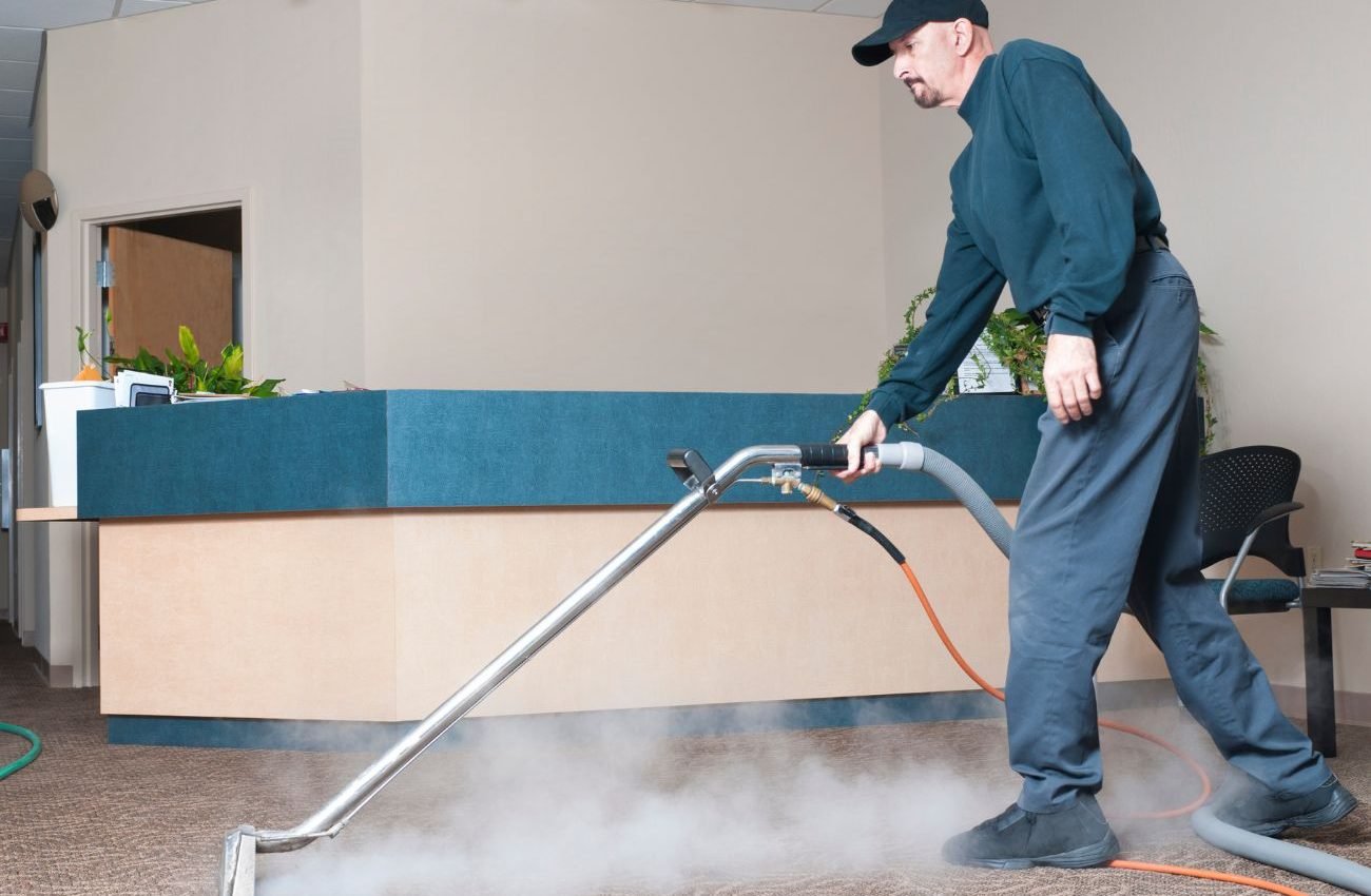 Keep Your Carpets Looking New with Protection Treatment A man cleans a room with a steam cleaner, representing a protection and prevention cleaning service based in Los Angeles, CA.